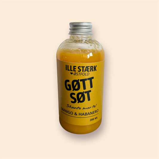 Søt chilisaus med mango – gyllen saus i flaske med gul etikett, fruktig og sterk